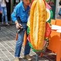 A hungry Tony takes a bite at a sandwich